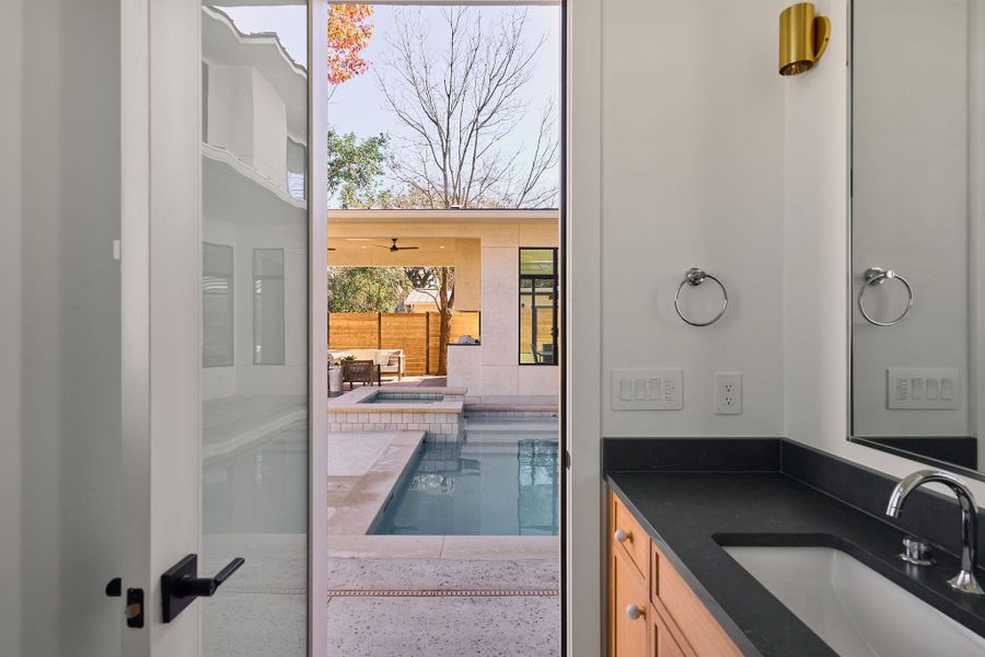 Restroom & second laundry room right off the pool!