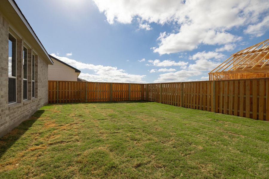 Exterior details and patio area of a home in Parmer Ranch, Georgetown (Image 21). Exterior details and patio area of a home in Parmer Ranch, Georgetown (Image 21).