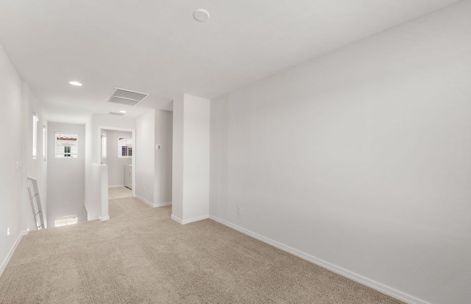 Spacious, unfurnished interior of a new home in Asante- Atrium Series, Surprise (Image 18).