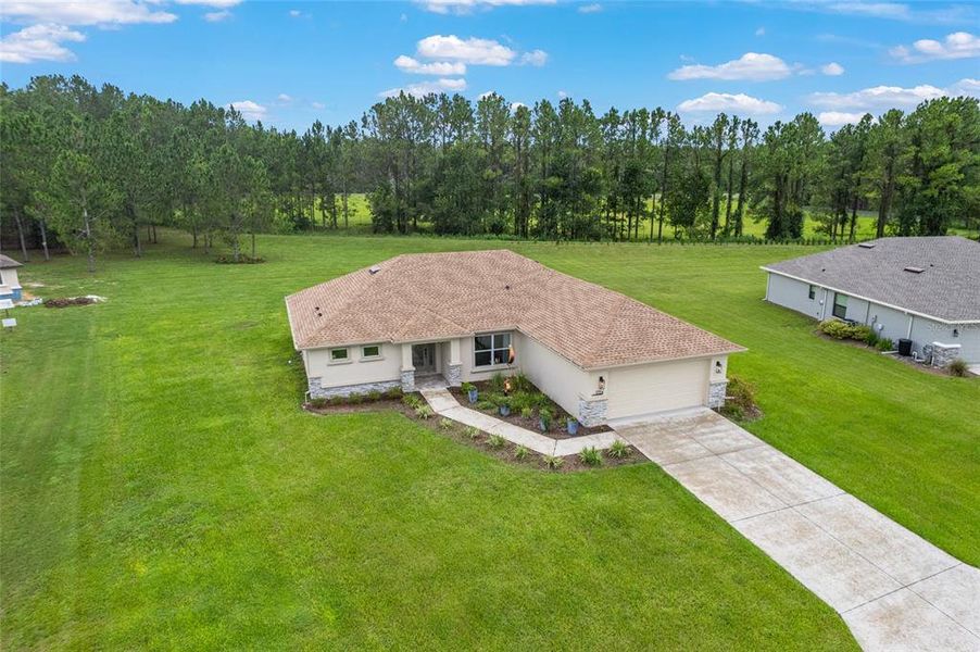 Front exterior of a new home in , Inverness, FL, highlighting curb appeal (Image 1).