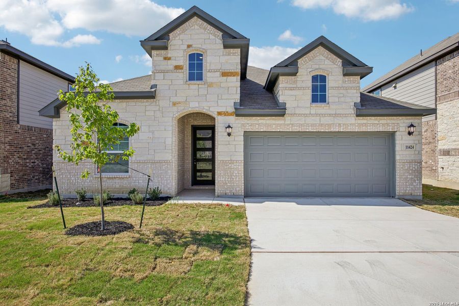 Front exterior of a new home in Sagebrooke - Classic Series, San Antonio, TX, highlighting curb appeal (Image 25).