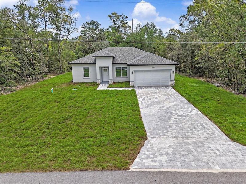 Front exterior of a new home in , Citrus Springs, FL, highlighting curb appeal (Image 2). Front exterior of a new home in , Citrus Springs, FL, highlighting curb appeal (Image 2).