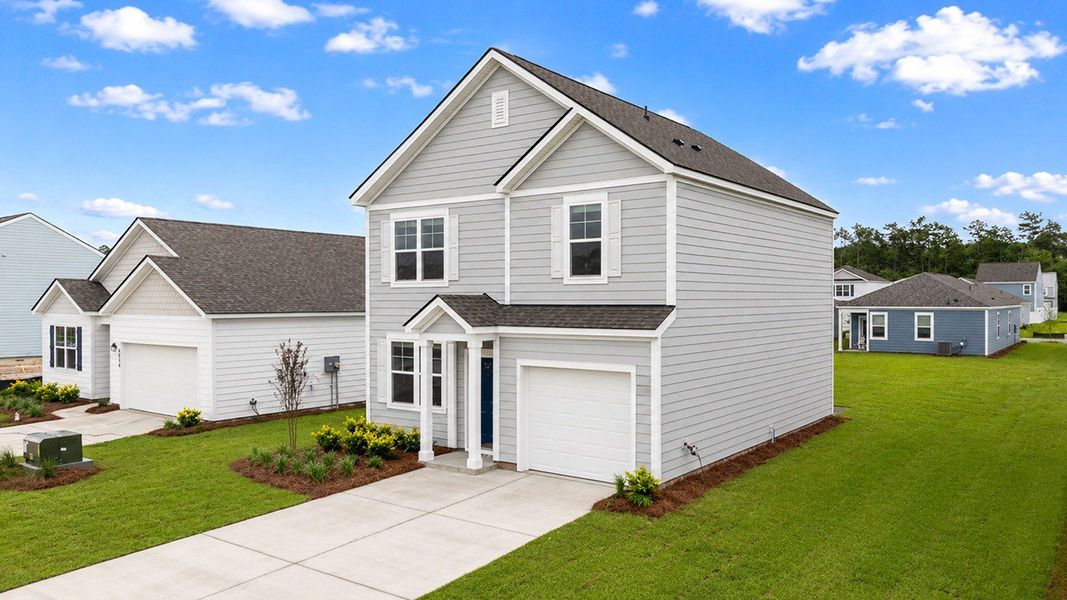 Front exterior of a new home in Hillcrest, Ravenel, SC, highlighting curb appeal (Image 2). Front exterior of a new home in Hillcrest, Ravenel, SC, highlighting curb appeal (Image 2).