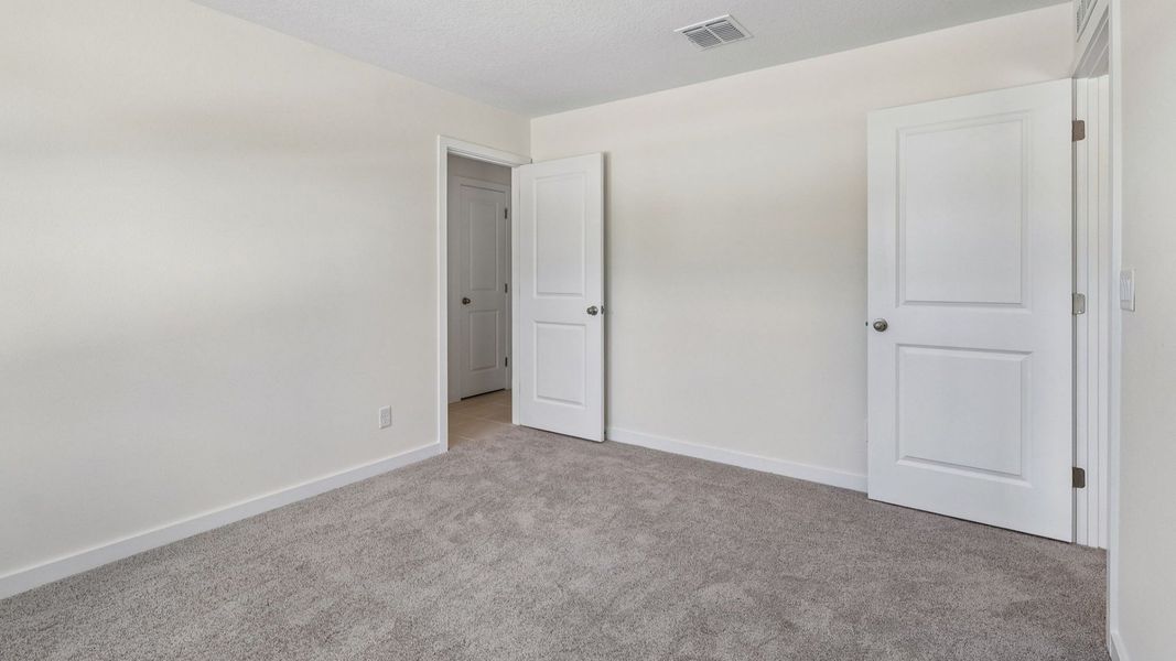 Furnished interior view inside a new home in Cyrene at Harmony, St. Cloud (Image 30). Furnished interior view inside a new home in Cyrene at Harmony, St. Cloud (Image 30).