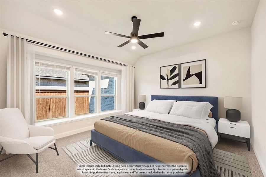 Bedroom with blue upholstered bed, ceiling fan, vaulted ceiling, and large windows with natural light
