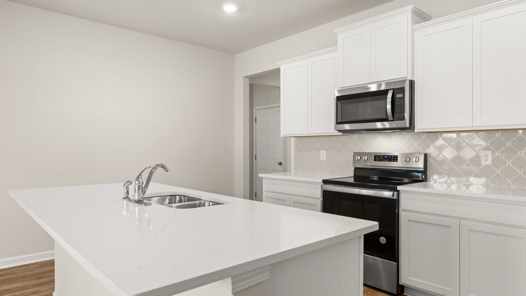 Furnished interior view inside a new home in Oakchase at Hampton, Hampton (Image 4).