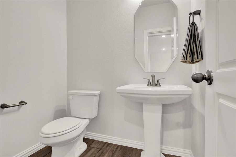 Bathroom featuring toilet and hardwood / wood-style floors