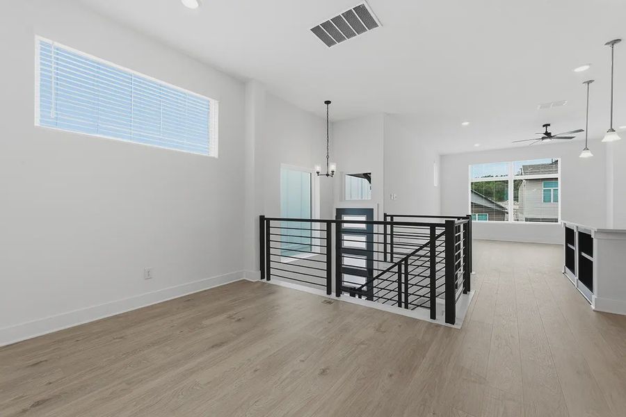Spacious, unfurnished interior of a new home in Centero at Stone Oak, San Antonio (Image 14).