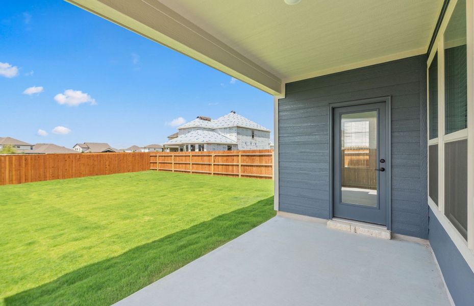 Exterior details and patio area of a home in Santa Rita Ranch, Liberty Hill (Image 29).