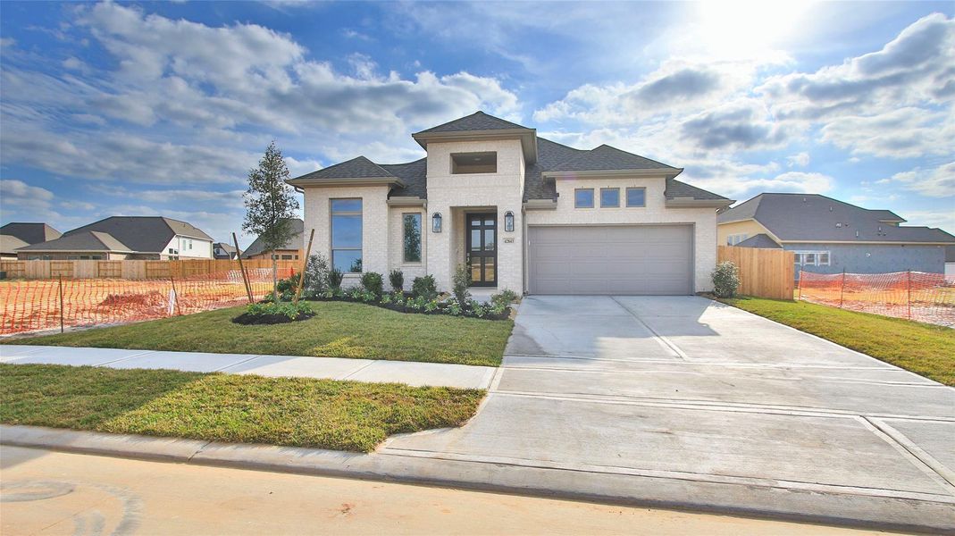 Front exterior of a new home in Escondido 50', Magnolia, TX, highlighting curb appeal (Image 2).