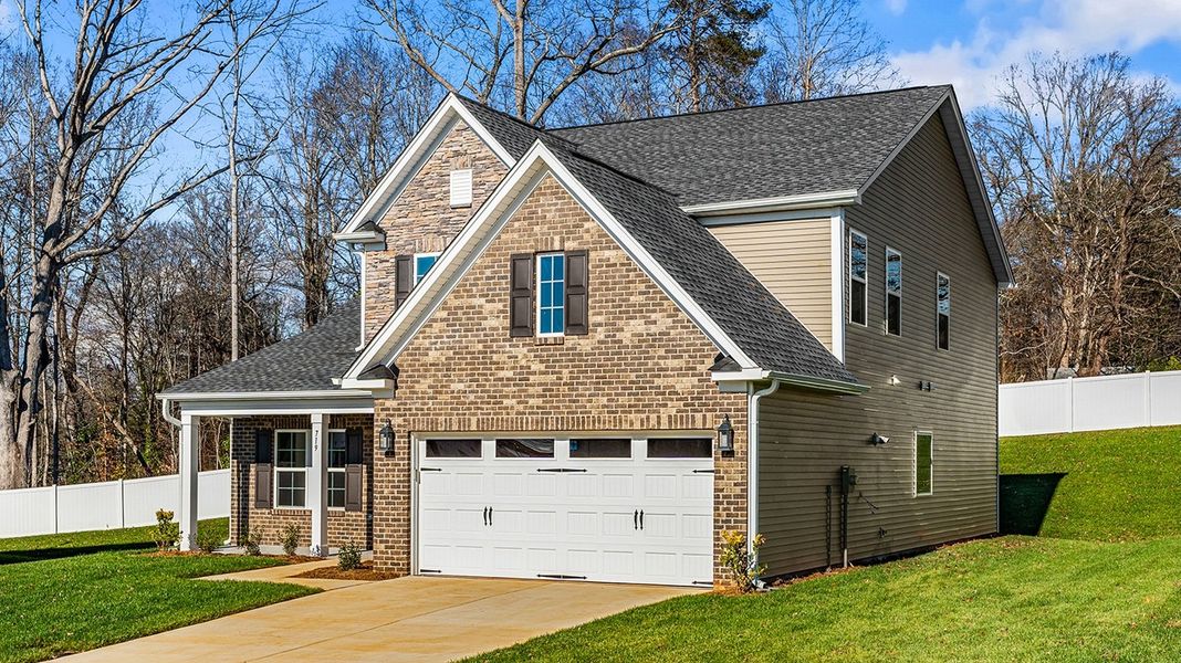 Front exterior of a new home in Hanes Lake, Winston-Salem, NC, highlighting curb appeal (Image 22).