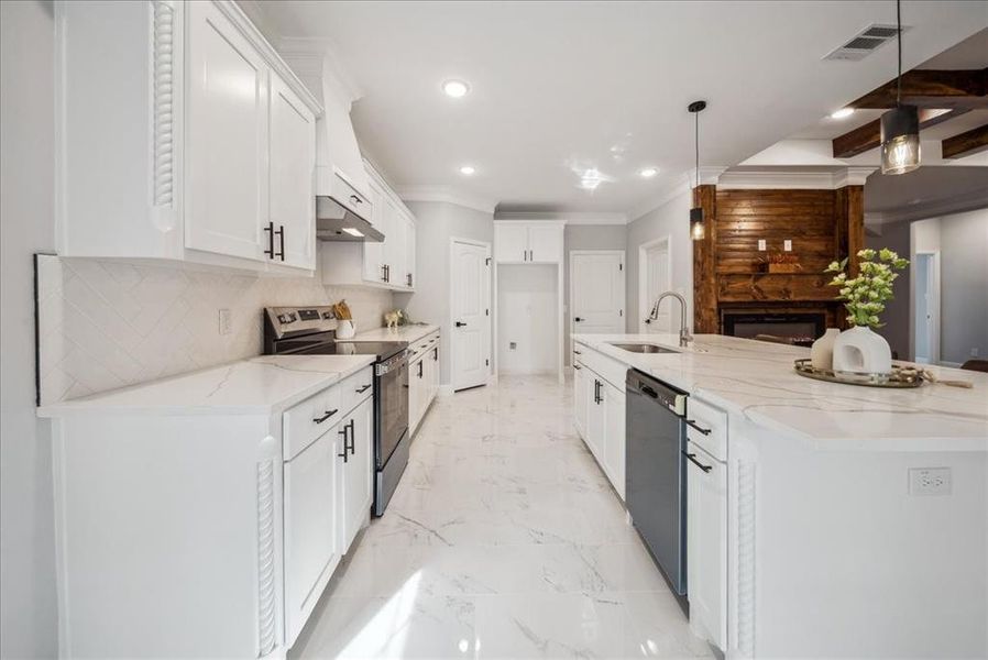 Kitchen with pendant lighting, dishwasher, white cabinetry, sink, and electric range