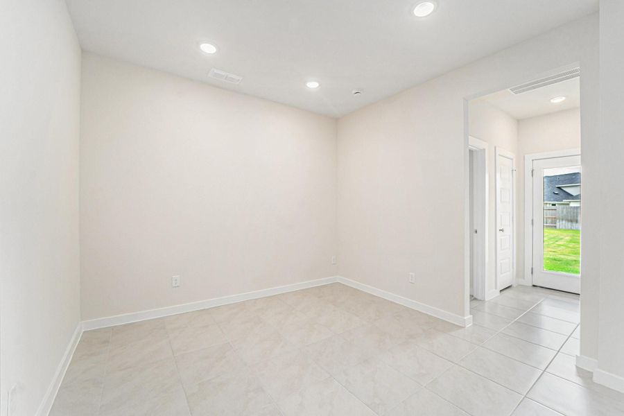 Large formal dining located just off the kitchen and family room Large formal dining located just off the kitchen and family room