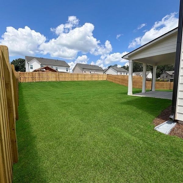 Exterior details and patio area of a home in Rosewood Lake Estates, Hoschton (Image 28).