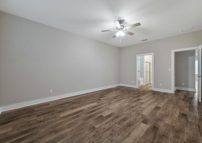 The master bedroom is spacious and has plenty of natural light