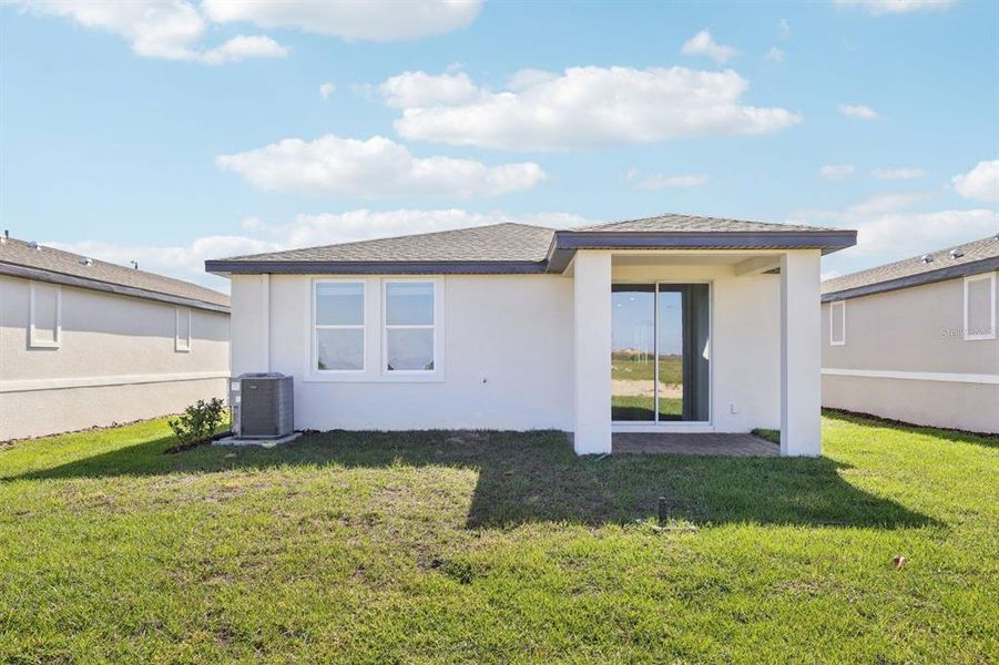 Exterior details and patio area of a home in Springs at Lake Alfred - Classic Series, Lake Alfred (Image 4).