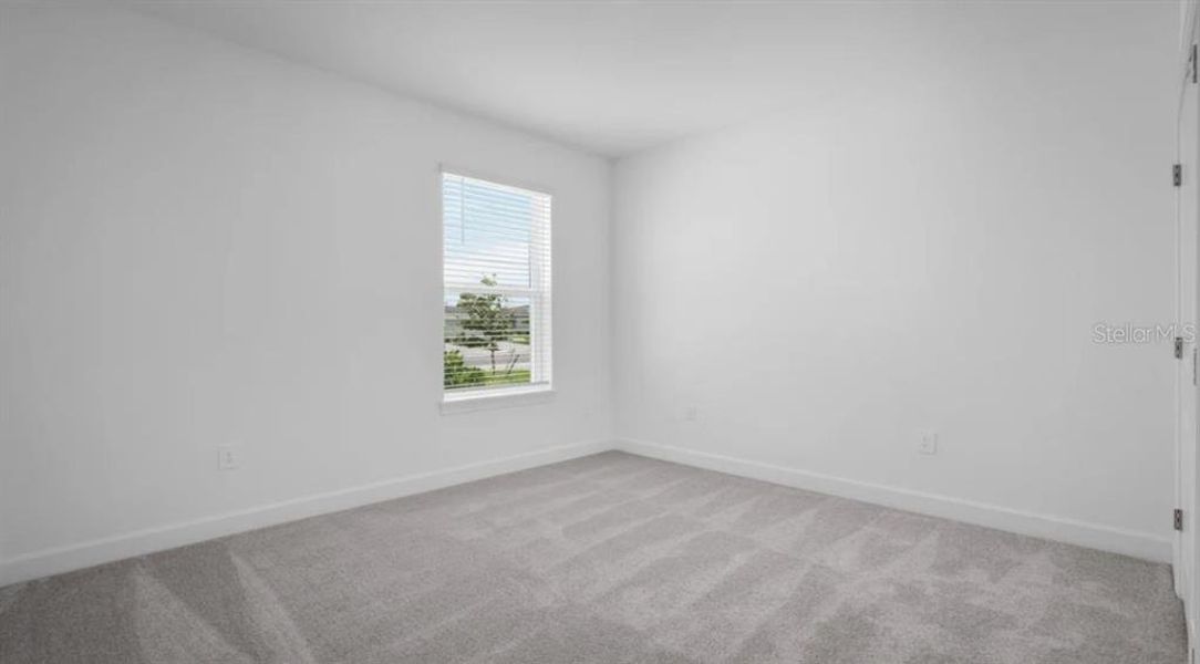 Spacious, unfurnished interior of a new home in The Cove at West Port, Port Charlotte (Image 14).