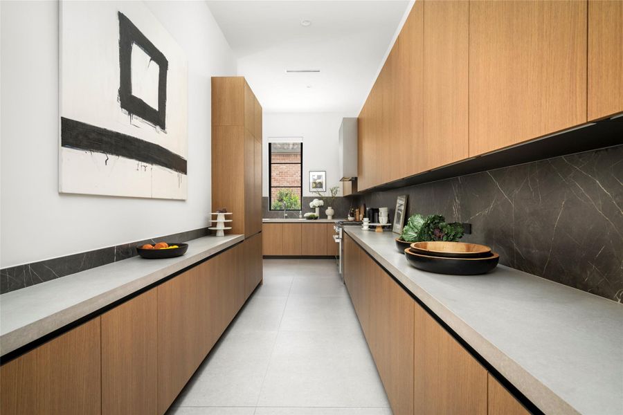 [Catering Kitchen/Scullery]  A second fridge, gas range, dishwasher; abundant counter space and cabinets.