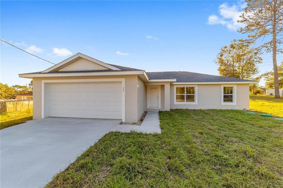 Front exterior of a new home in , Ocala, FL, highlighting curb appeal (Image 21).