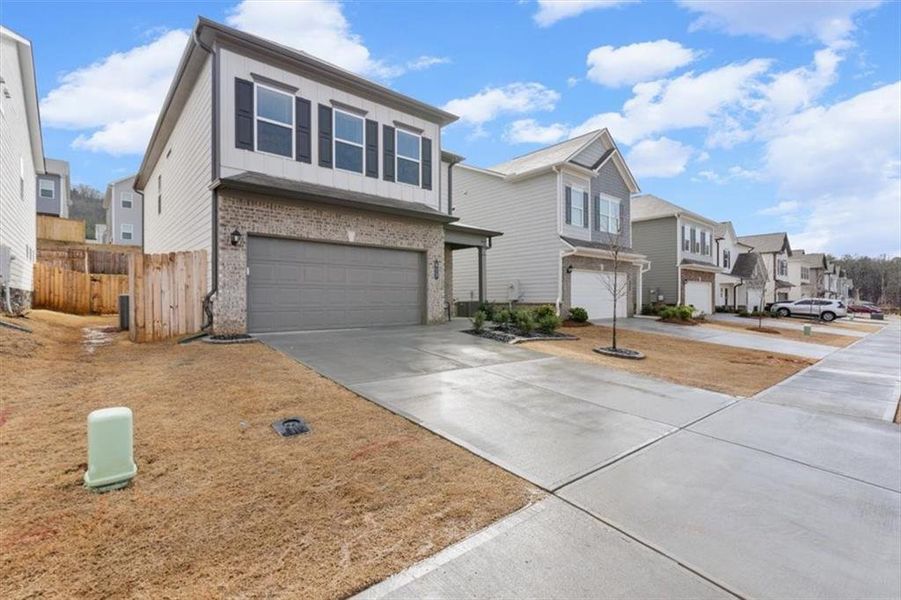 Front exterior of a new home in , Cartersville, GA, highlighting curb appeal (Image 26).