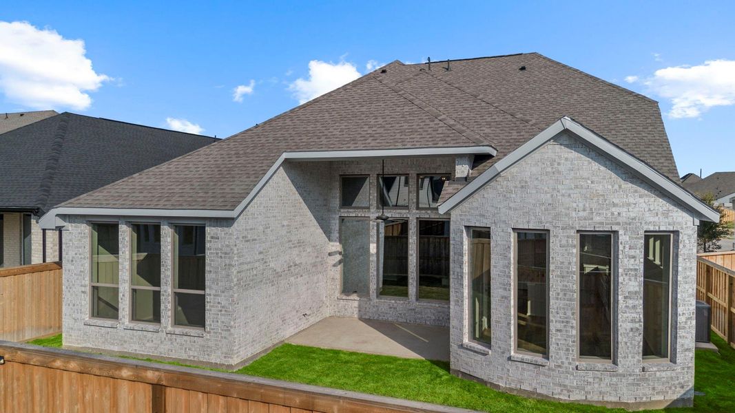 Exterior details and patio area of a home in Dunham Pointe 50', Cypress (Image 22).