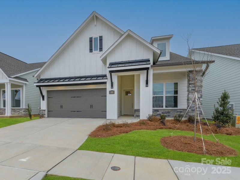 Front exterior of a new home in Encore at Streamside - Classic Series, Waxhaw, NC, highlighting curb appeal (Image 22).