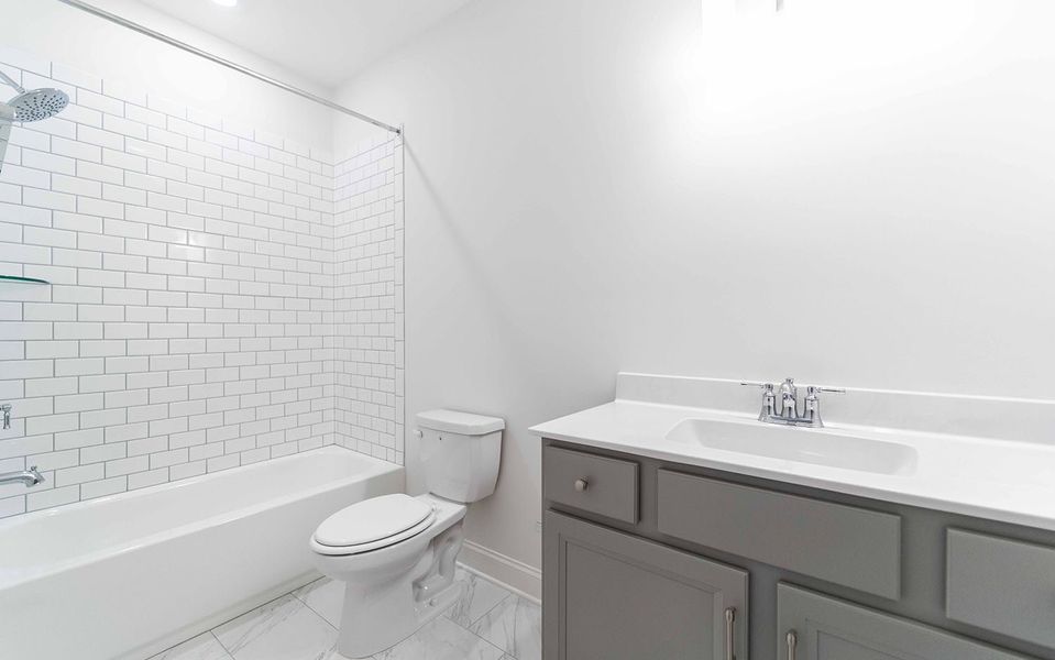 Furnished interior view inside a new home in Aden Woods, Fairview (Image 12).