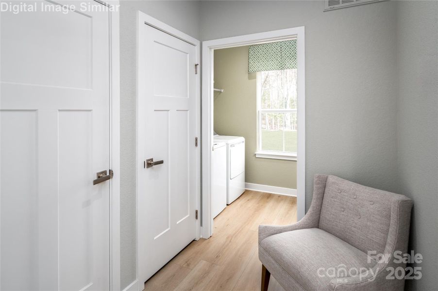 Step in through the family entrance and discover a cozy corner perfect for unwinding with a book while the laundry hums away. Tucked behind sleek, discreet doors lies a hidden gem—extra storage and a coat closet that keeps clutter out of sight and calm vibes front and center.