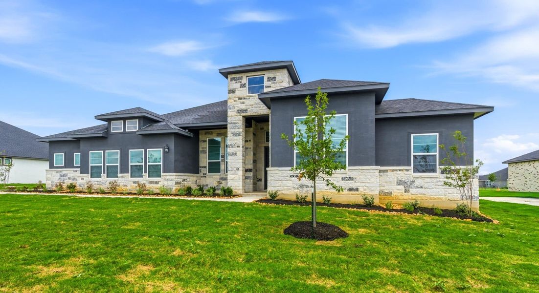 Front exterior of a new home in Sienna Lakes, San Antonio, TX, highlighting curb appeal (Image 27). Front exterior of a new home in Sienna Lakes, San Antonio, TX, highlighting curb appeal (Image 27).