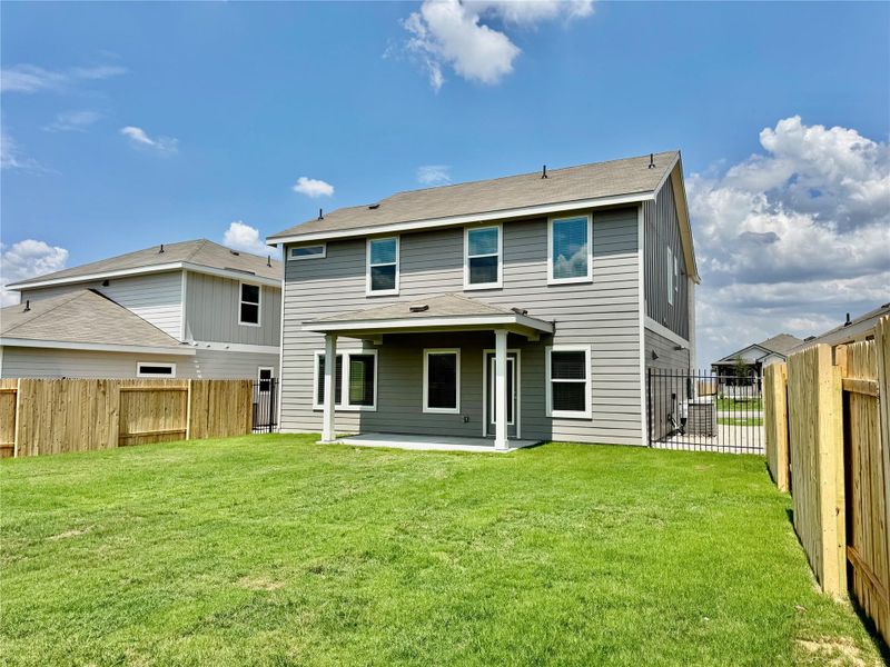 Rear view of property featuring a patio and a fenced backyard Rear view of property featuring a patio and a fenced backyard
