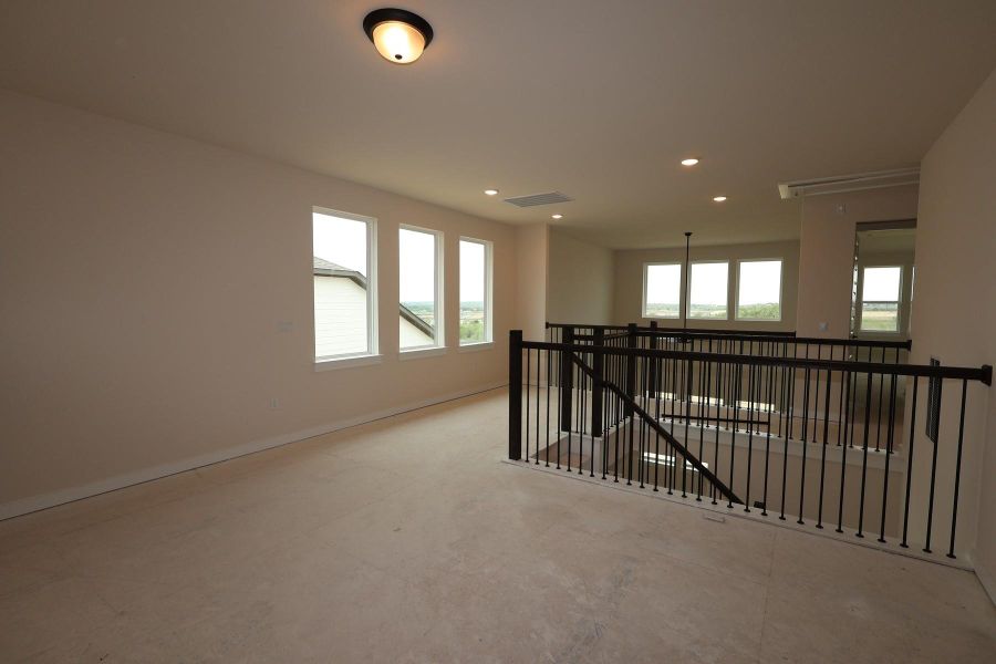 Spacious, unfurnished interior of a new home in Terrace Collection At Turner's Crossing, Buda (Image 10).