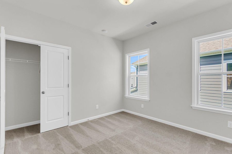 Spacious, unfurnished interior of a new home in Tidewater at Lakes of Cane Bay, Summerville (Image 15). Spacious, unfurnished interior of a new home in Tidewater at Lakes of Cane Bay, Summerville (Image 15).
