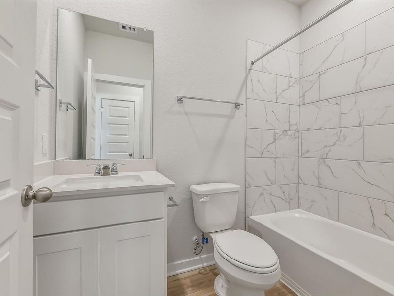 Furnished interior view inside a new home in Caney Creek Place, Conroe (Image 13).