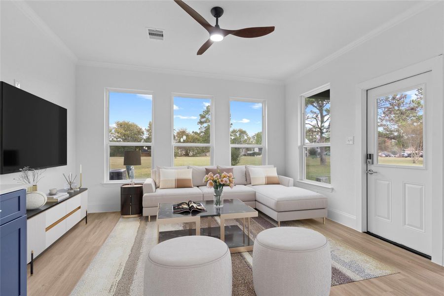 The family area has a dramatic view of nature with the custom tall windows!  Crown molding throughout for that touch of style! *Virtual stage* What amazing lifestyle to come home to!