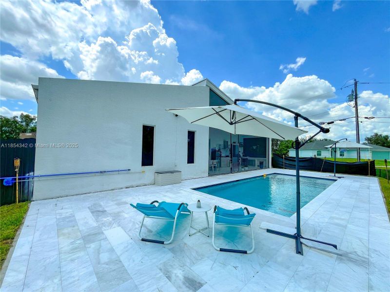 Front exterior of a new home in , Lehigh Acres, FL, highlighting curb appeal (Image 32). Front exterior of a new home in , Lehigh Acres, FL, highlighting curb appeal (Image 32).