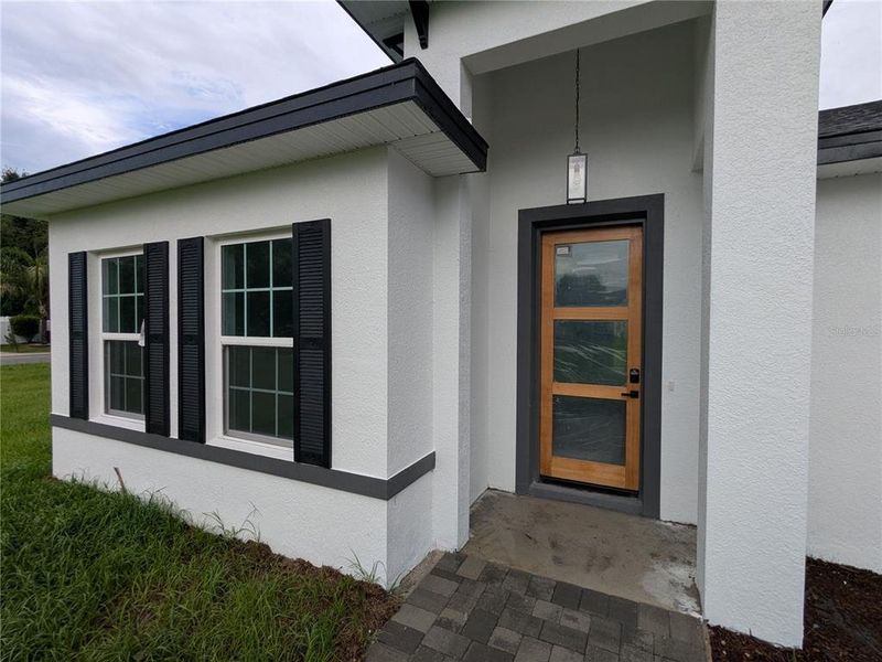 Front exterior of a new home in , Ocala, FL, highlighting curb appeal (Image 10).
