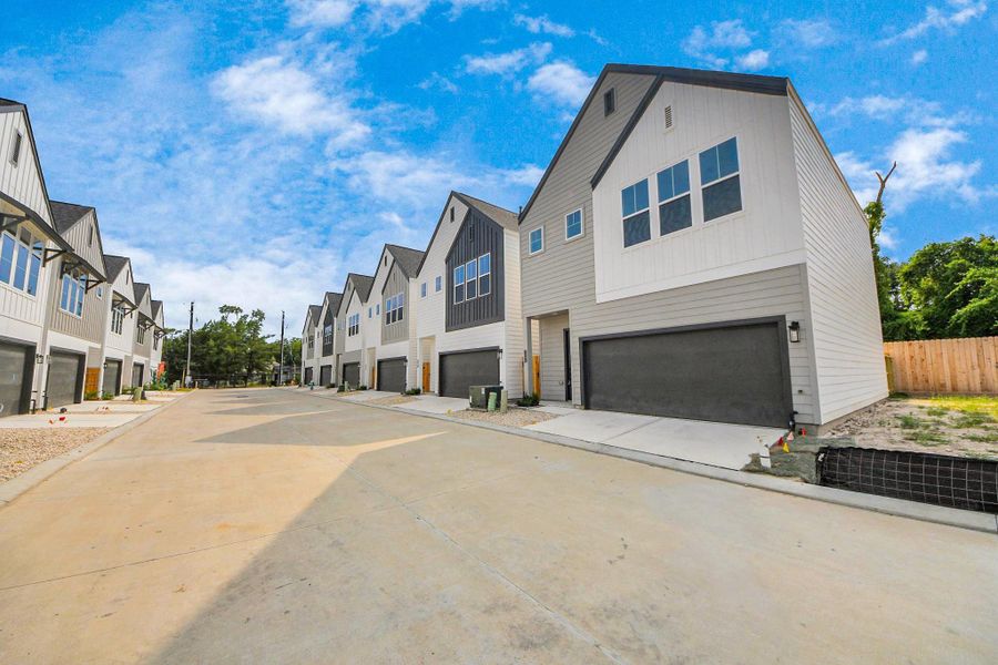 Front exterior of a new home in Highland Gardens, Houston, TX, highlighting curb appeal (Image 24).