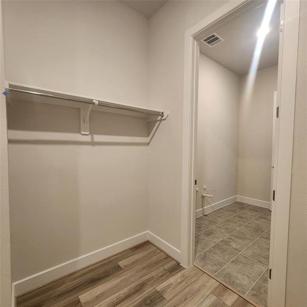 master closet has access to laundry room