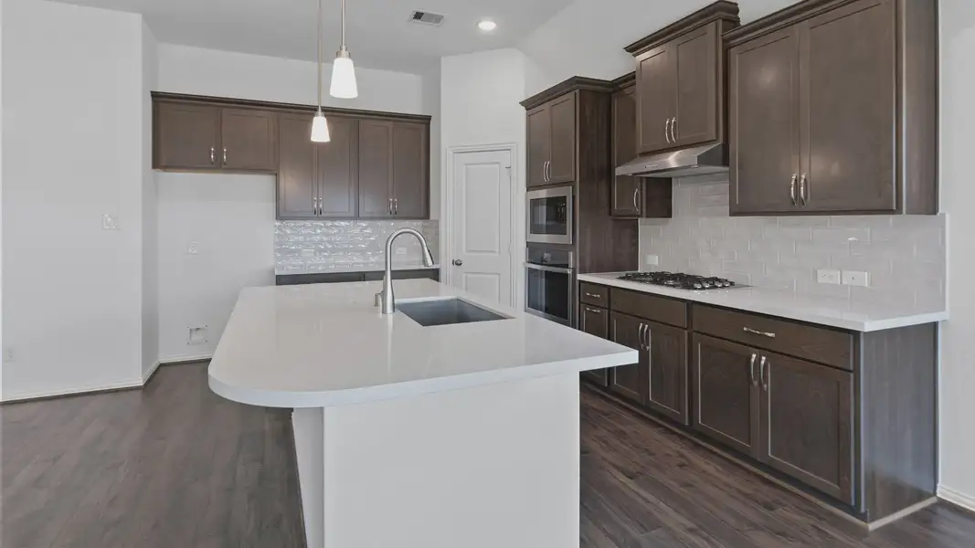 Furnished interior view inside a new home in Sunterra, Katy (Image 15).