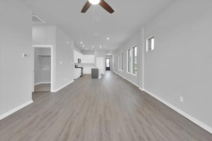 Spacious, unfurnished interior of a new home in Sunterra 40, Katy (Image 31).