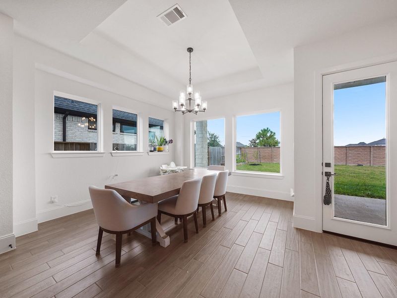 Perfectly positioned off the kitchen and living room, the dining space is filled with natural light and backyard views. Its inviting atmosphere makes everything from weekday meals to holiday gatherings feel special.