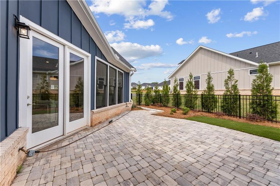 Exterior details and patio area of a home in The Courtyards of Franklin Goldmine, Cumming (Image 19).