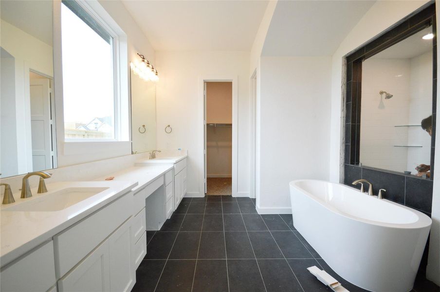Elegant Primary Bath Featuring Dual Vanities and Modern Finishes
