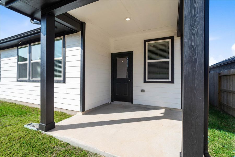 The spacious covered patio offers a tranquil outdoor retreat, perfectly designed for savoring your quiet morning coffee or unwinding during peaceful evening relaxation.