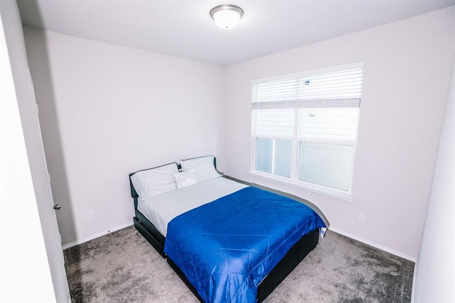 Bedroom featuring carpet floors