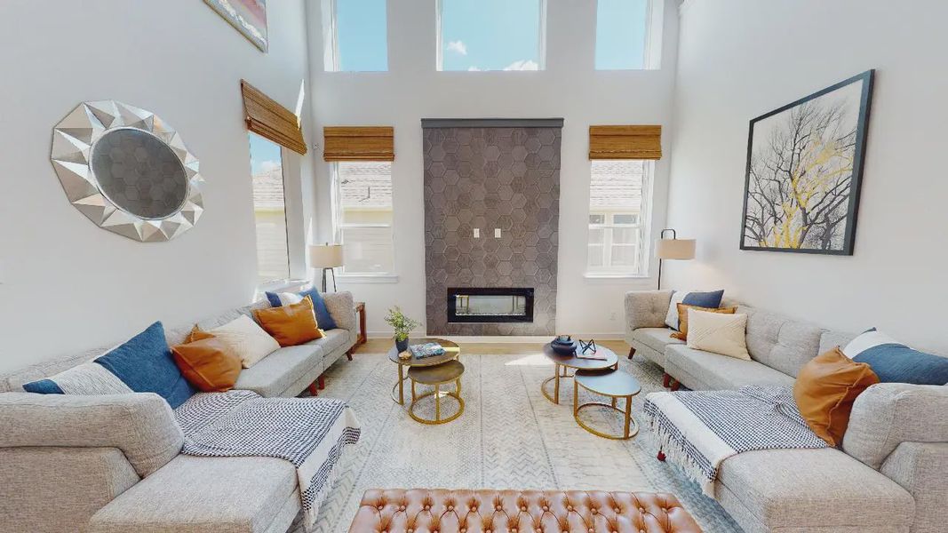 Representative furnished interior of a home built from the Saxony by Chesmar Homes in Sunterra, Katy (Image 5).