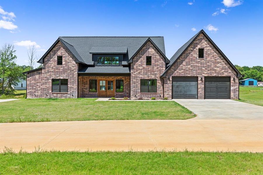 Front exterior of a new home in , Tyler, TX, highlighting curb appeal (Image 21). Front exterior of a new home in , Tyler, TX, highlighting curb appeal (Image 21).