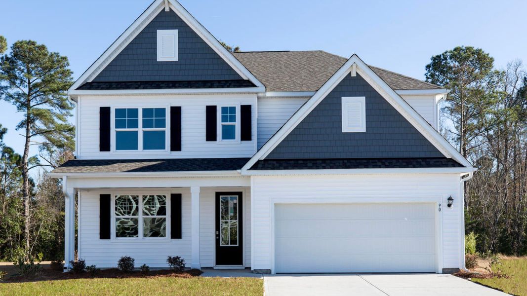 Representative exterior photo of a completed home built from the HARBOR OAK by D.R. Horton in The Grove at Blake Farm, Wilmington, NC (Image 2). Representative exterior photo of a completed home built from the HARBOR OAK by D.R. Horton in The Grove at Blake Farm, Wilmington, NC (Image 2).