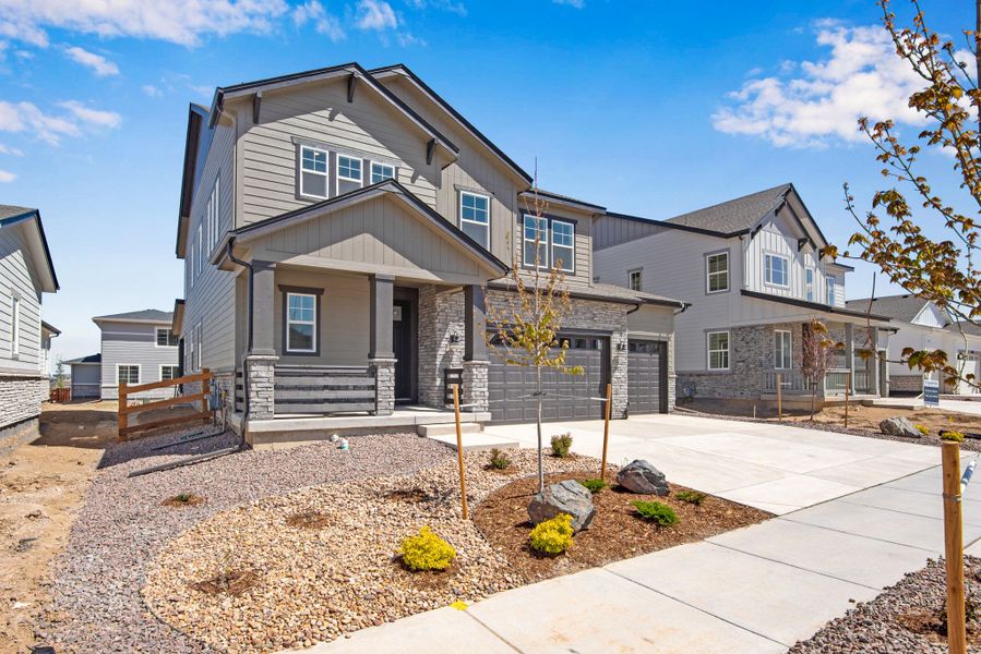 Front exterior of a new home in The Aurora Highlands, Aurora, CO, highlighting curb appeal (Image 23).