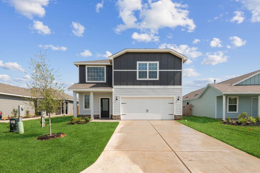 Front exterior of a new home in Sweetwater Ridge, Conroe, TX, highlighting curb appeal (Image 1).